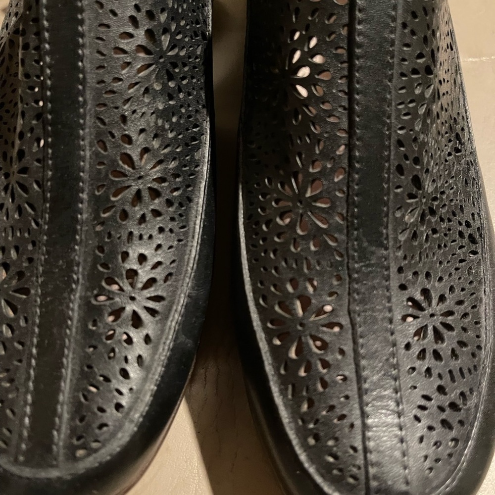 Sling back black shoes.